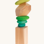 Grimm's Natural Wooden Gem on a plain background. 