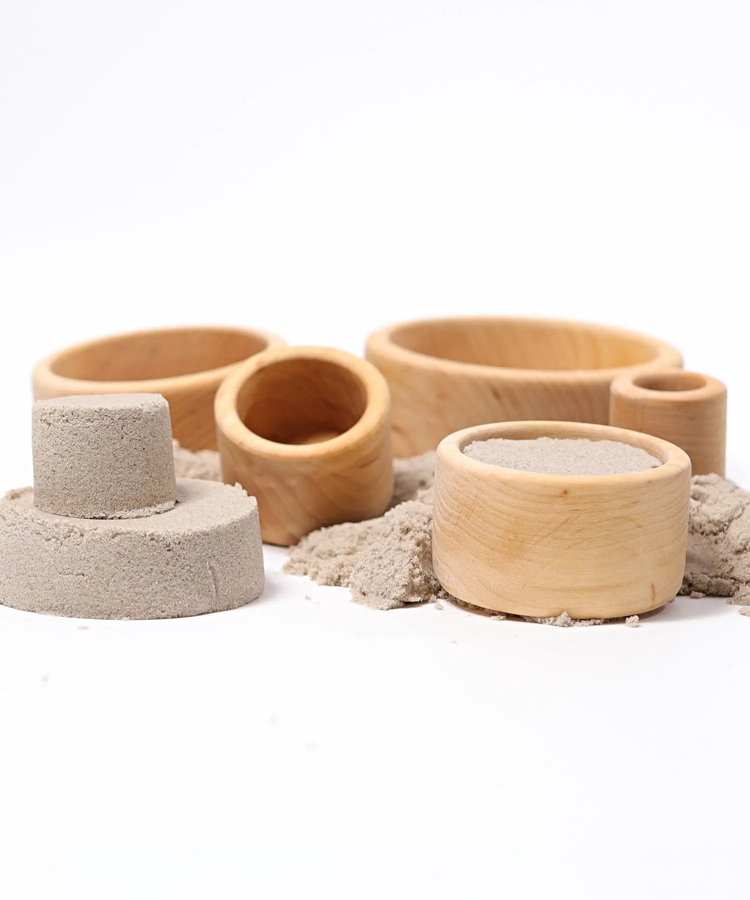 Grimms natural wooden bowls with sand inside them
