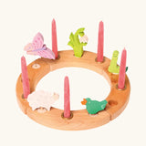 Grimm's handcrafted wooden celebration ring with various decorative figures including a butterfly snowdrop, worm, signing bird and sheep