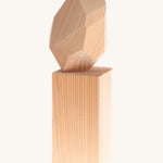 Grimm's Natural Wooden Gem on a plain background. 