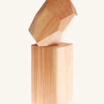 Grimm's Natural Wooden Gem on a plain background. 