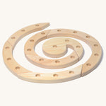 Grimm's Natural Wooden Spiral celebration ring n a plain background. 