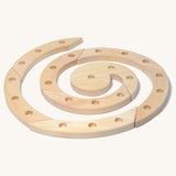 Grimm's Natural Wooden Spiral celebration ring n a plain background. 
