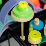 Trees made from Grimms handcrafted wooden neon green conical pieces on natural round bases