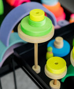 Trees made from Grimms handcrafted wooden neon green conical pieces on natural round bases