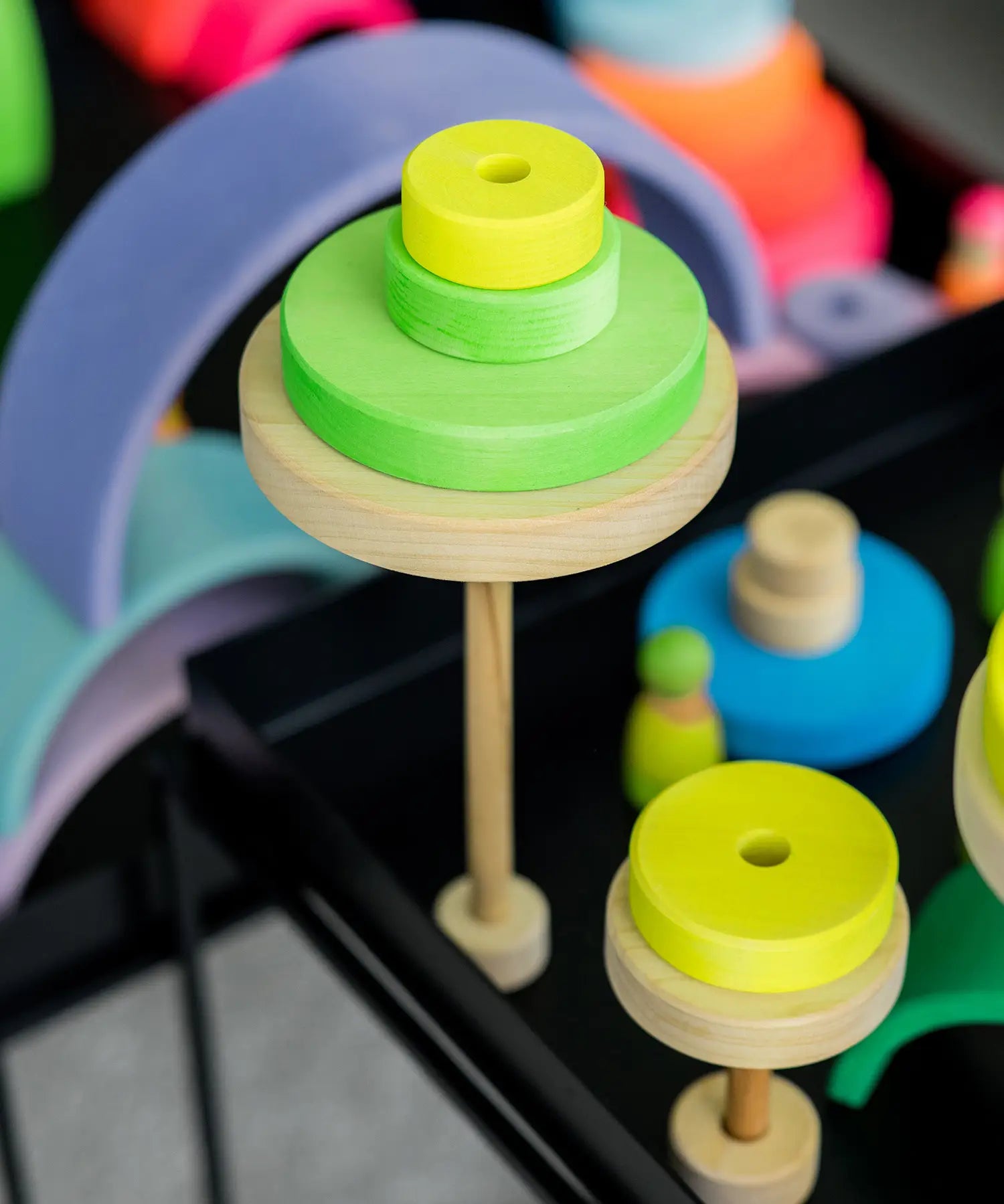 Trees made from Grimms handcrafted wooden neon green conical pieces on natural round bases