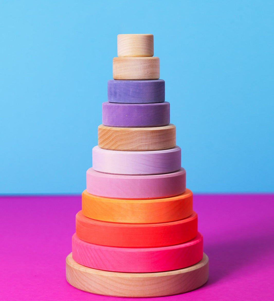 Grimms handcrafted wooden conical tower in neon pink colour way and a natural base. 