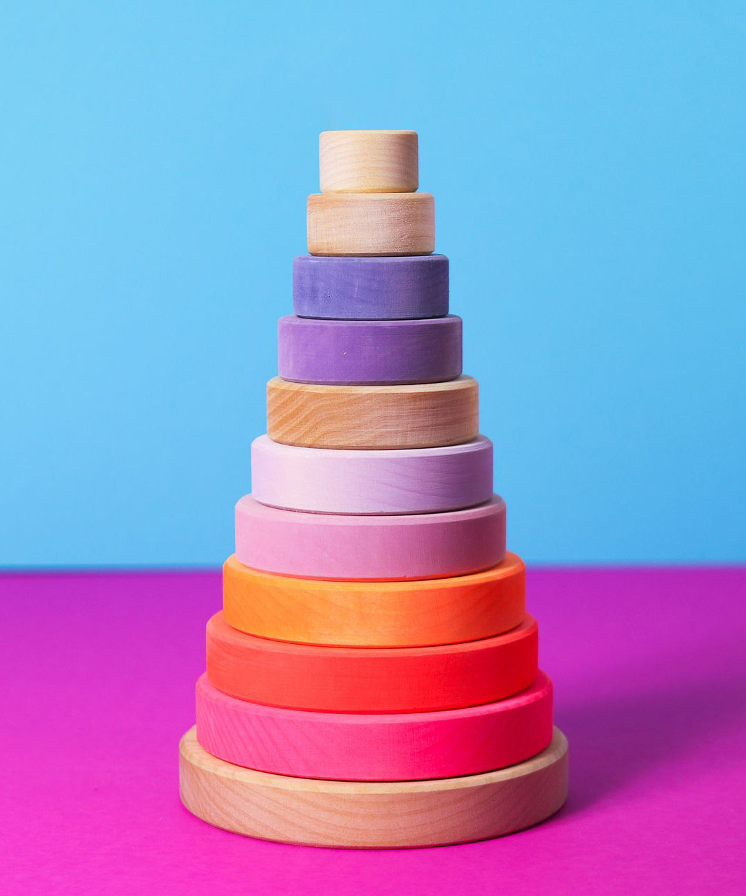 Grimms handcrafted wooden conical tower in neon pink colour way and a natural base. 
