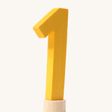 A yellow coloured number one Grimm's Decorative Number figure to fit a Grimm's celebration ring. These numbers are part of a large range of decorative figures available here at Babipur. 