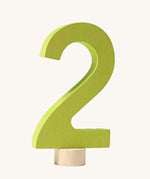 A green coloured number two Grimm's Decorative Number figure to fit a Grimm's celebration ring. These numbers are part of a large range of decorative figures available here at Babipur. 