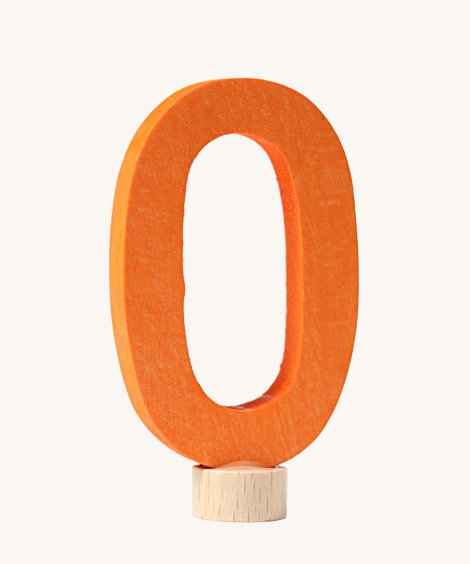 An orange coloured number zero Grimm's Decorative Number figure to fit a Grimm's celebration ring. These numbers are part of a large range of decorative figures available here at Babipur. 