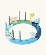Grimm's handcrafted wooden celebration ring displayinga boat, two dolphins, seagull, elephant and a palm tree decorative figure