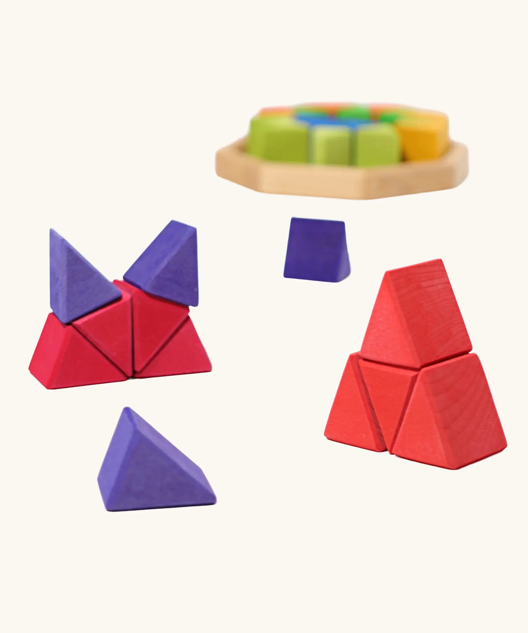 Grimm's octagon puzzle. 32 piece chunky triangle blocks in a wooden storage display tray. Small stacks created using the blocks.