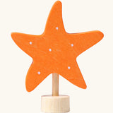 Grimm's handcrafted wooden orange starfish decorative figure with a unpainted stand