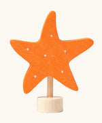 Grimm's handcrafted wooden orange starfish decorative figure with a unpainted stand