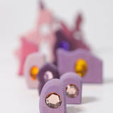 Purple pieces from the Grimm's orient sparkling building set wooden toy.