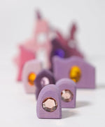 Purple pieces from the Grimm's orient sparkling building set wooden toy.