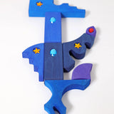 Blue and purple pieces from the Grimm's orient sparkling building set wooden toy.