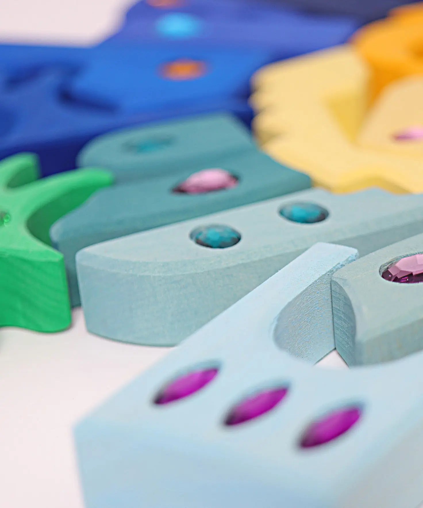Close up of the sides of the blocks from the Grimm's orient sparkling building set wooden toy.