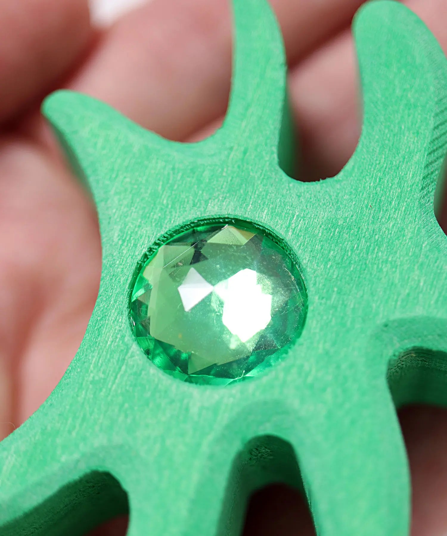 Close up of sparkly gem on one of the pieces from Grimm's orient sparkling building set wooden toy.