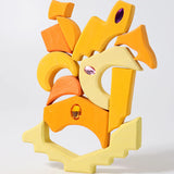 Yellow pieces from the Grimm's orient sparkling building set wooden toy.