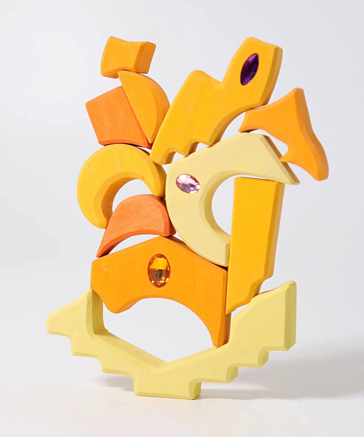 Yellow pieces from the Grimm's orient sparkling building set wooden toy.