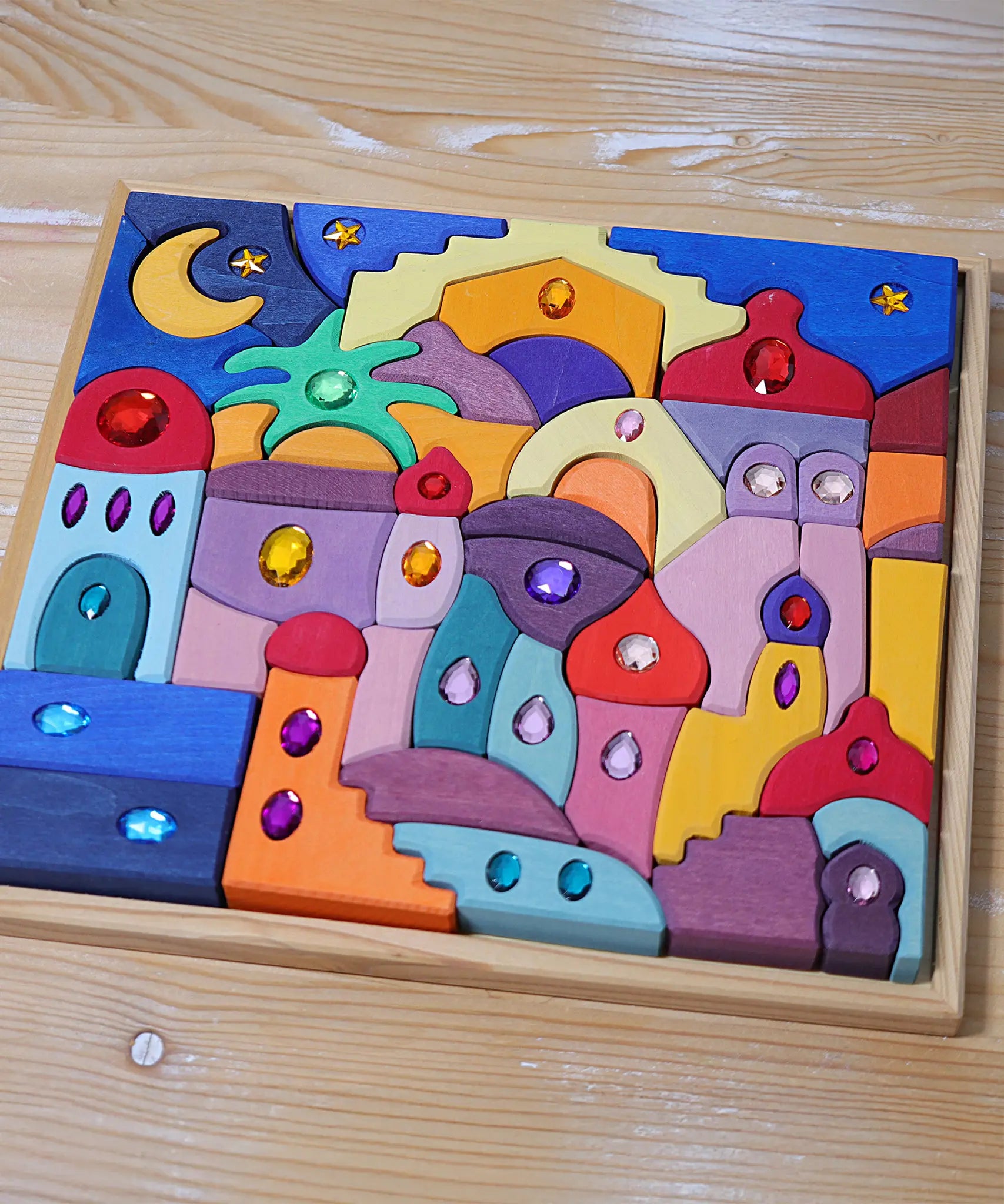 Grimm's orient sparkling building set wooden toy in it's wooden display storage tray.
