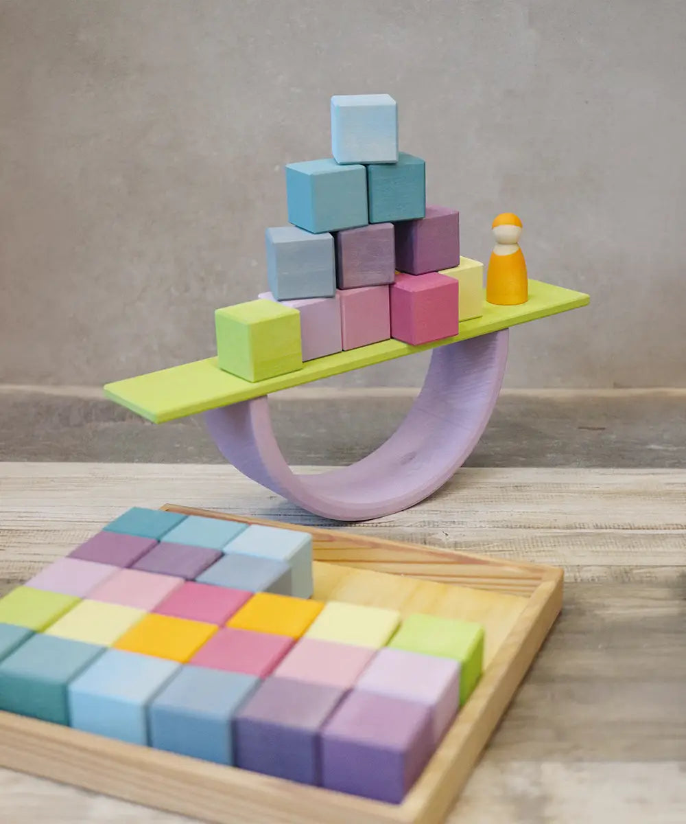 A boat structure made from Grimms pastel wooden blocks, archway and board piece