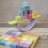 A boat structure made from Grimms pastel wooden blocks, archway and board piece