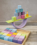 A boat structure made from Grimms pastel wooden blocks, archway and board piece