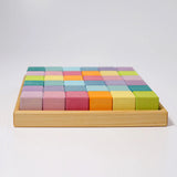 Side of a Grimms 36 cubes set in pastel colours standing in a wooden frame