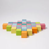Loose Grimm's wooden pastel cubes made into a diamond shape