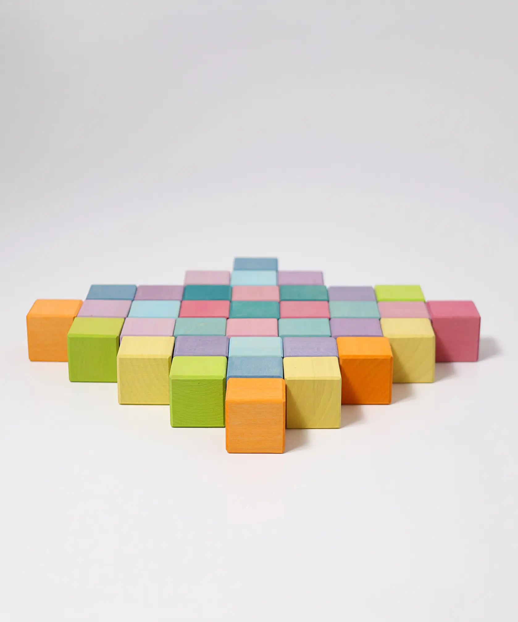 Loose Grimm's wooden pastel cubes made into a diamond shape