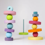 Grimm's small wooden pastel balls balancing on matching rings