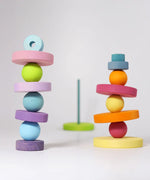 Grimm's small wooden pastel balls balancing on matching rings
