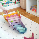 A ball run made from Grimms wooden pastel building boards and archway pieces in the Babipur playroom