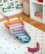 A ball run made from Grimms wooden pastel building boards and archway pieces in the Babipur playroom