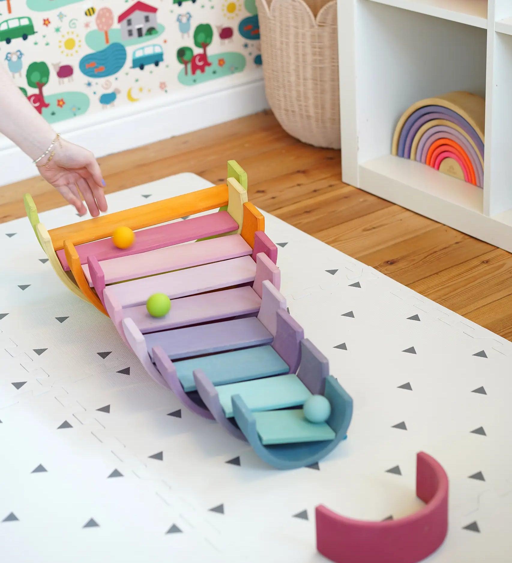 A ball run made from Grimms wooden pastel building boards and archway pieces in the Babipur playroom