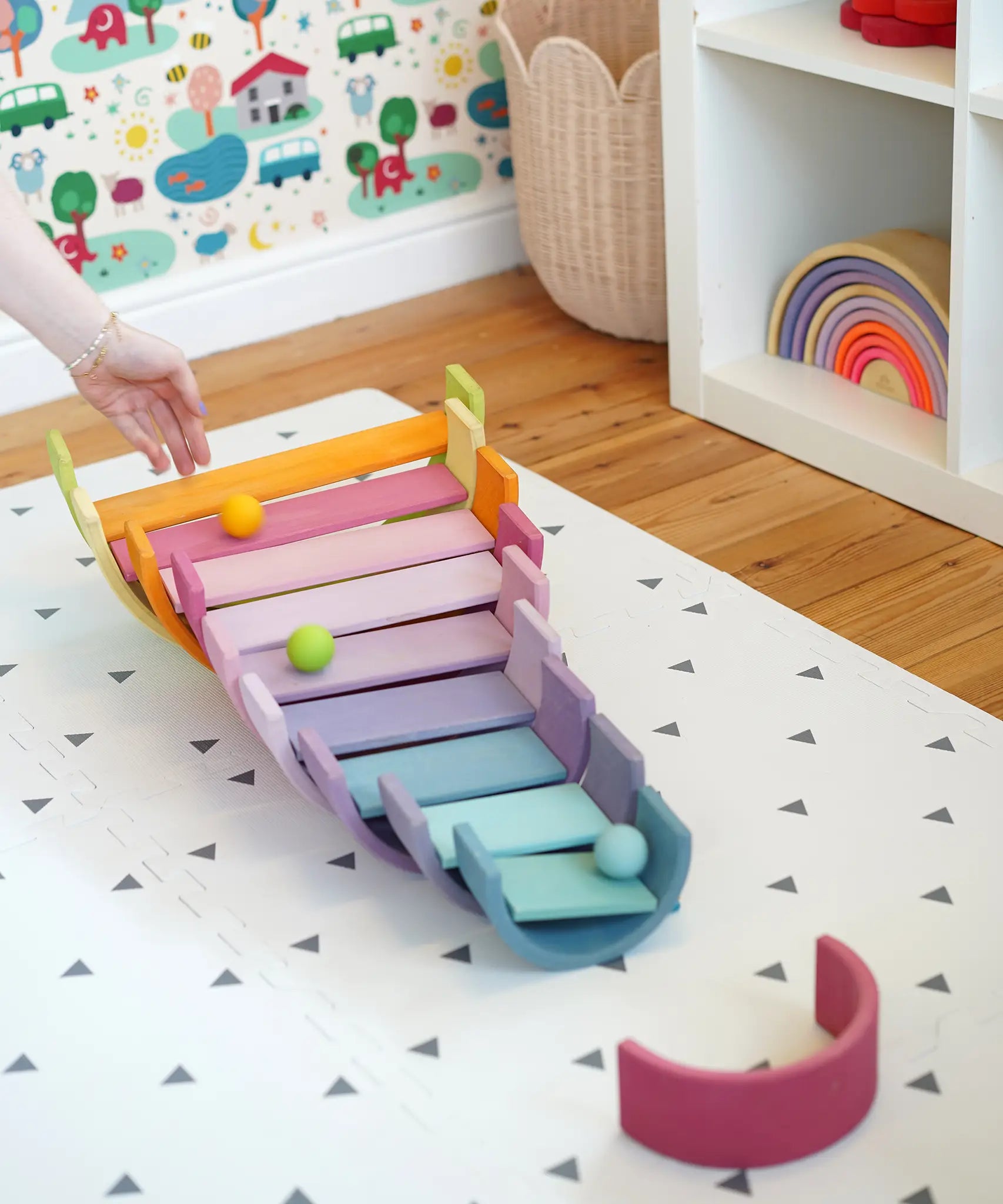 A ball run made from Grimms wooden pastel building boards and archway pieces in the Babipur playroom
