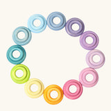 Set of 24 Grimms handcrafted wooden rings in a pastel palette in small and large sizes