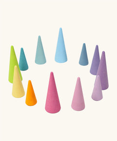 Grimms set of 12 tall and short wooden cone shaped pieces in a pastel palette. Perfect for learning games and building