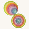 Full Grimm’s concentric wooden circle and ring set laid out by size and colour, ideal for sensory play, stacking, and sorting.