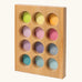 Grimms handcrafted wooden sorting board with 12 round slots in delicate pastel colours, made for sorting games