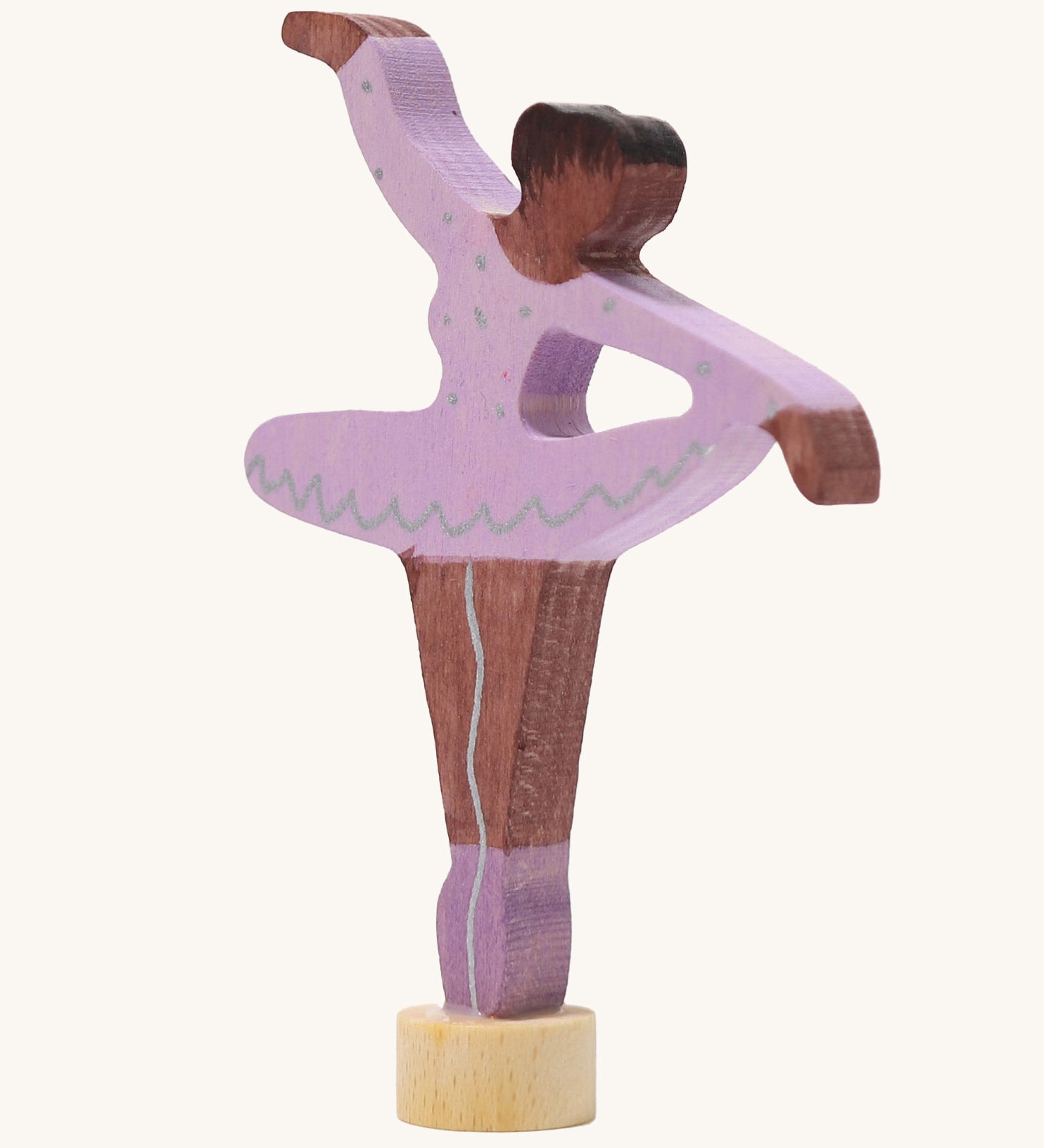 A Grimms wooden ballerina decorative figure in purple. Features a small base on the bottom to slot into the celebration ring.