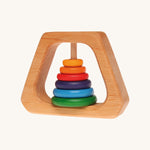 Grimm's Grasping Pyramid Rattle for babies on a cream background