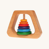 Grimm's Grasping Pyramid Rattle for babies on a cream background