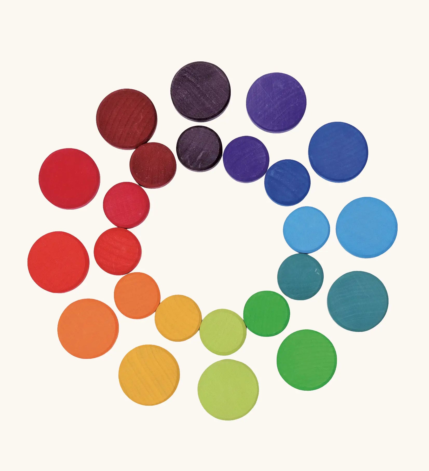Grimm's wooden coins in a rainbow palette. Perfect for learning and counting games