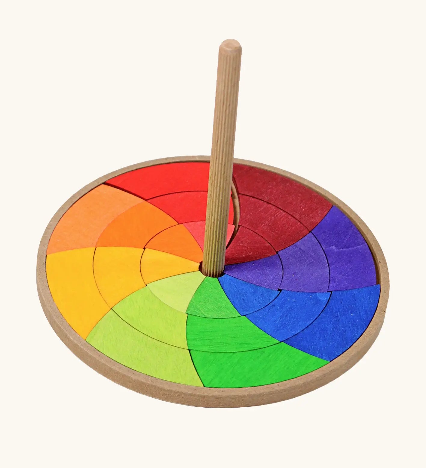 Grimms handcrafted wooden rainbow hand spinning top with loose pieces in bright colours to create new beautiful patterns 