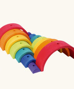 Grimm's rainbow stacking tower. 2 7-piece rainbows shown next to each other.