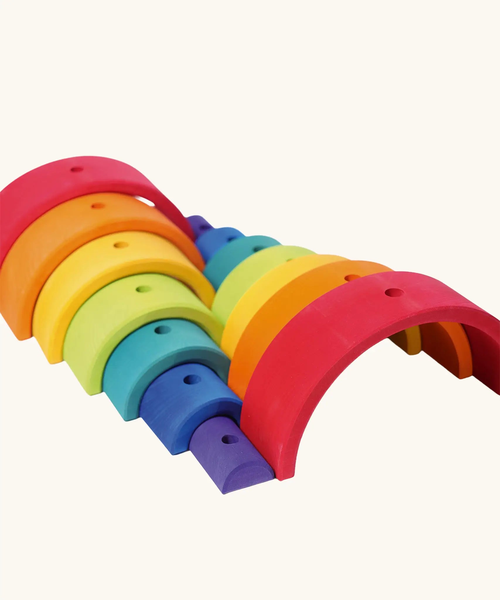 Grimm's rainbow stacking tower. 2 7-piece rainbows shown next to each other.